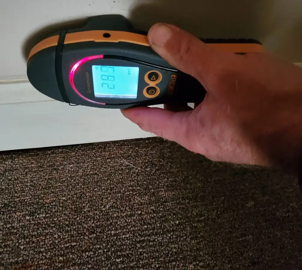 Moisture detection at baseboard during Storm Damage Restoration in Brandermill